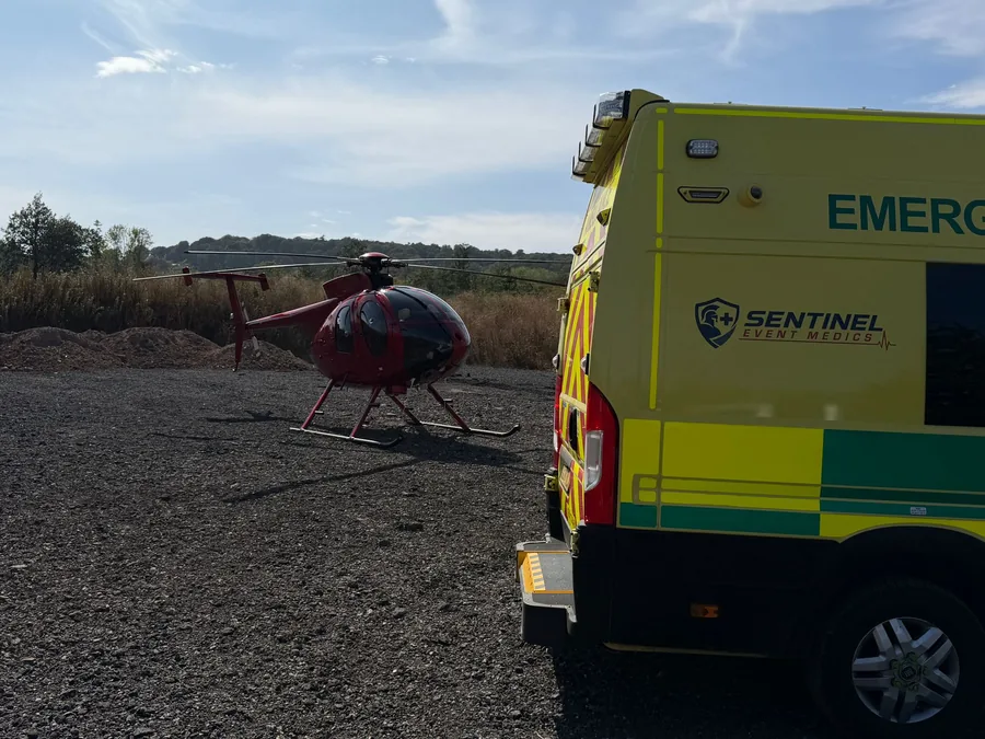 Sentinel Event Medics ambulance on standby beside a helicopter during filming