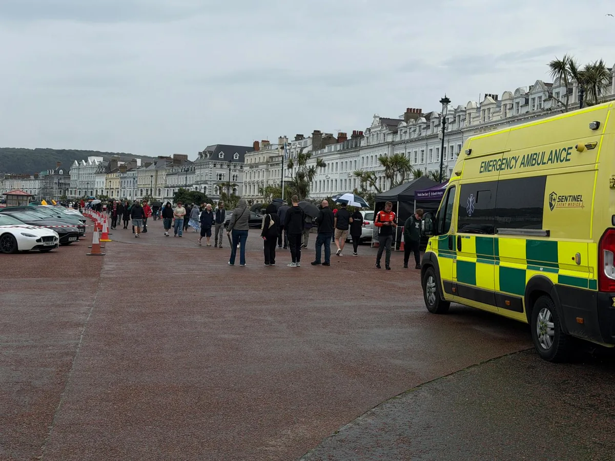 Sentinel Event Medics ambulance on duty as supercars line up during early setup on Llandudno Promenade