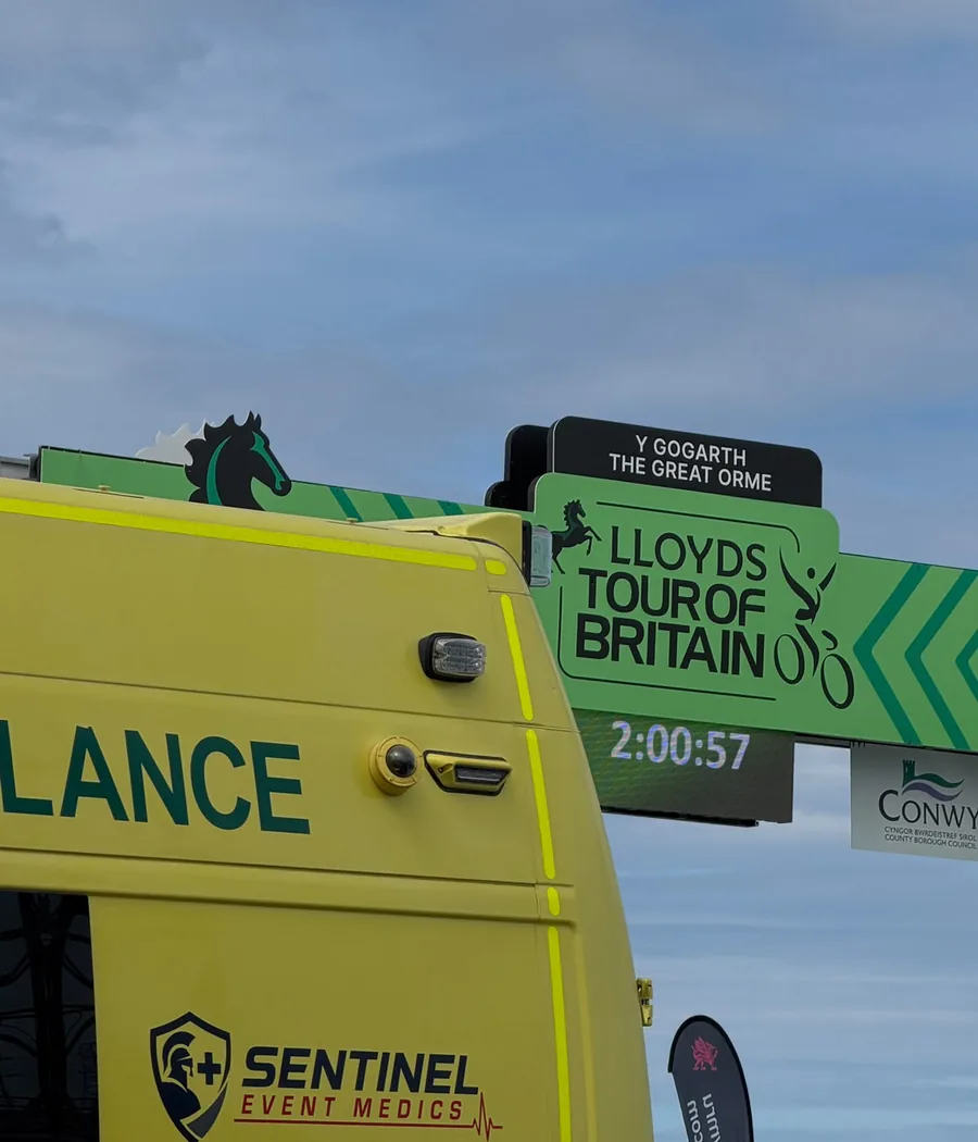 Sentinel Event Medics ambulance beneath the Lloyds Tour of Britain finish gantry on the Great Orme, Llandudno